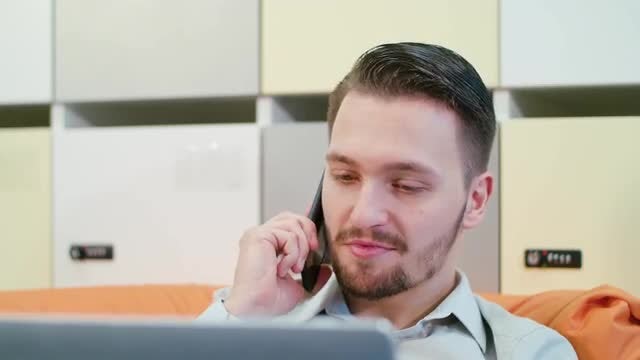 Talking On The Phone Indoors: Stock Video