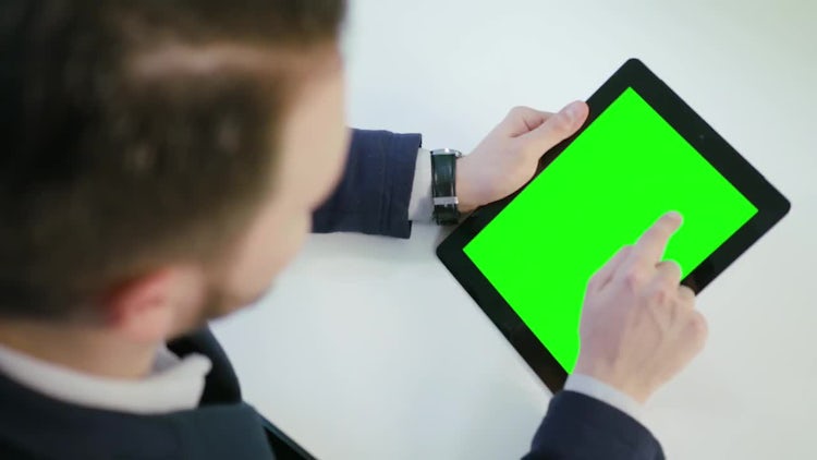 Man Using Tablet With A Green Screen: Stock Video
