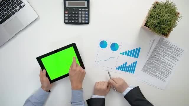 Businessmen Analyzing Business Graphs: Stock Video