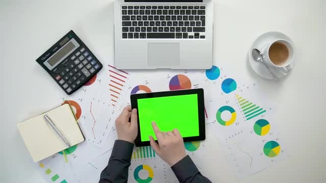 Swiping A Tablet With Graphs: Stock Video