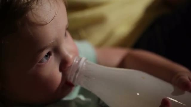 Boy Drinks Yogurt From A Bottle: Stock Video