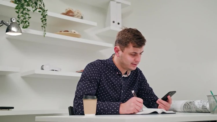 Young Man Taking Notes: Stock Video