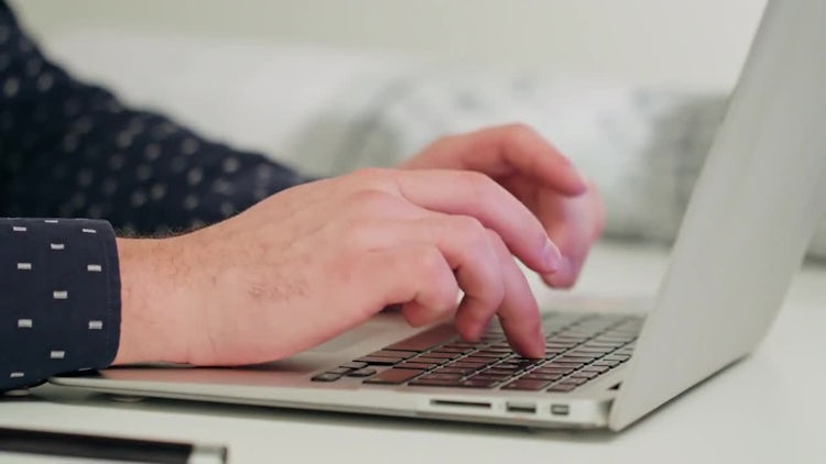 Man's Hands Typing On A Laptop.: Stock Video