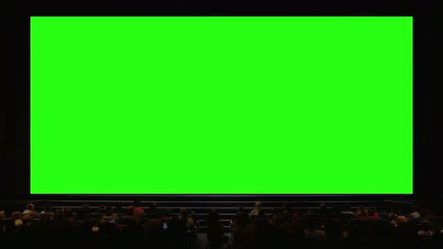 People In Auditorium With Green Screen: Stock Video