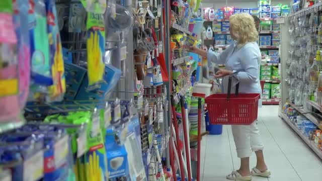 Old Lady Shopping At Supermarket : Stock Video