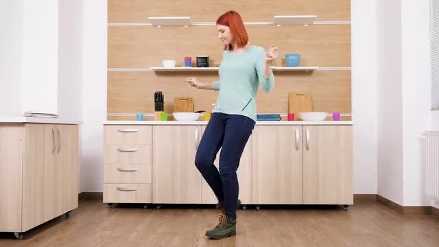 Beautiful Lady Dancing In Kitchen: Stock Video