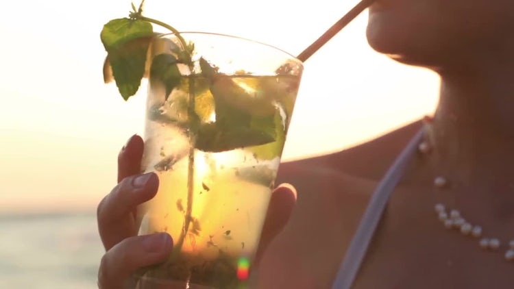 Woman Enjoying Tropical Mojito Cocktail: Stock Video