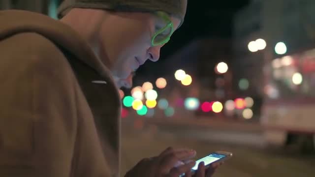 Using Phone At Bus Stop: Stock Video