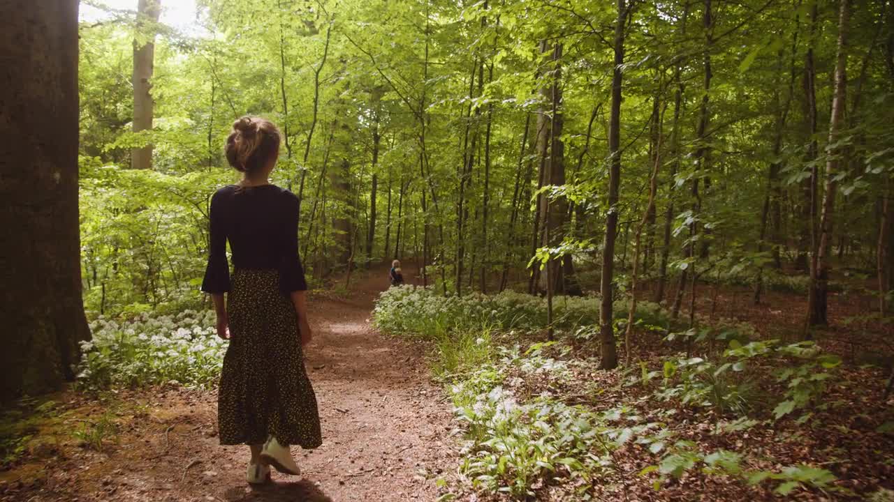 Girl walking in fashion woods