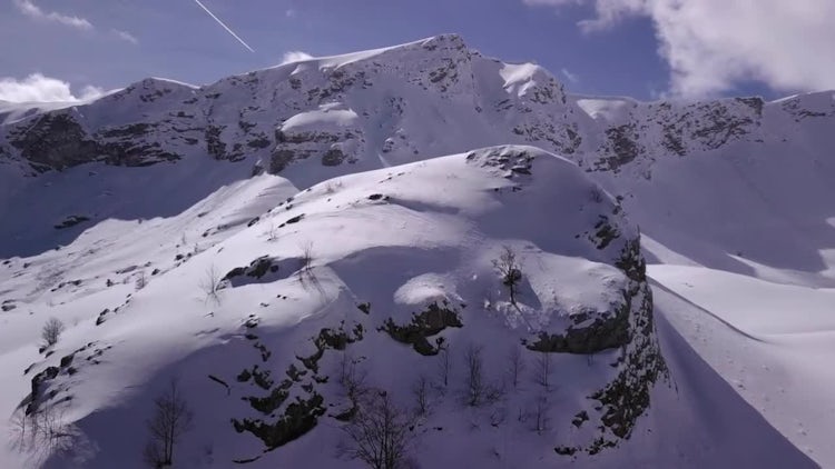 Aerial View Of Snowy Mountain: Stock Video