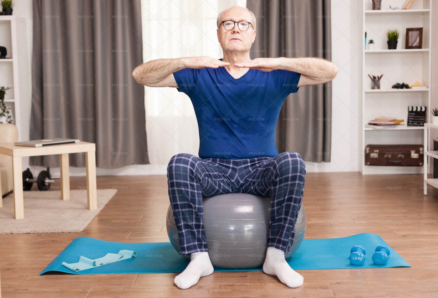 Senior Man Training On Stability Ball: Stock Photos