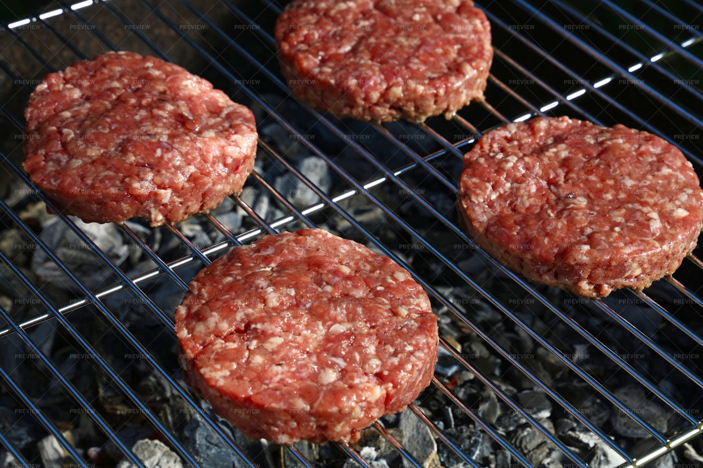 Beef Burgers On The Grill: Stock Photos