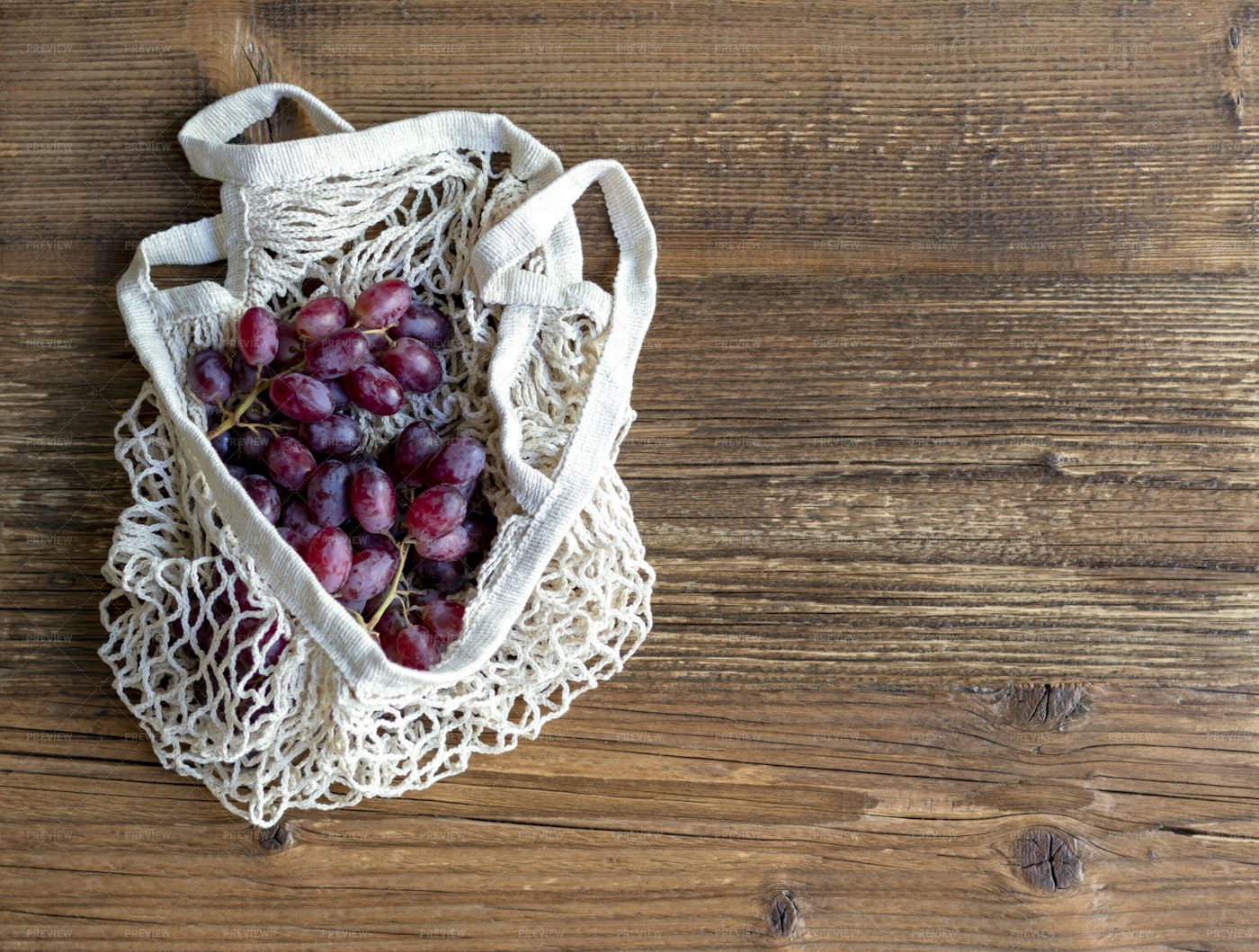 Red Grapes In A String Bag: Stock Photos