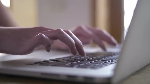 Woman Typing On Laptop Computer: Stock Video