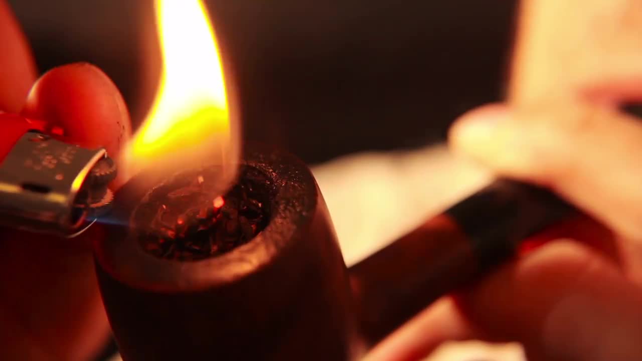 Lighting And Smoking A Pipe Stock Video Motion Array