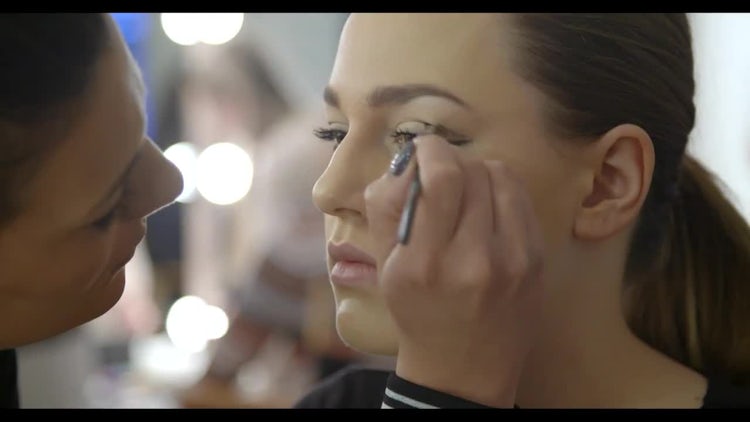 Makeup Artist Applying Eye Liner: Stock Video