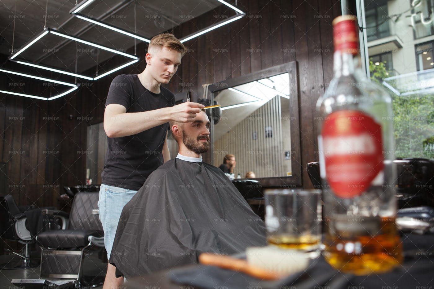 A Barber Gives A Haircut: Stock Photos