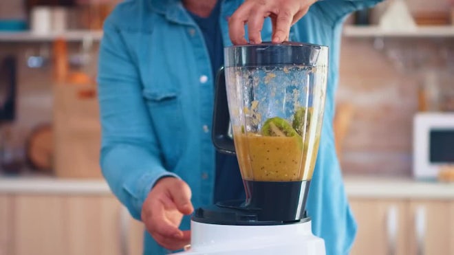 Abundance Of Fruit Around A Blender For Making Smoothies Stock