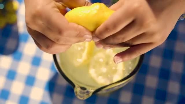 Squeezing Lemon Into Lemonade: Stock Video