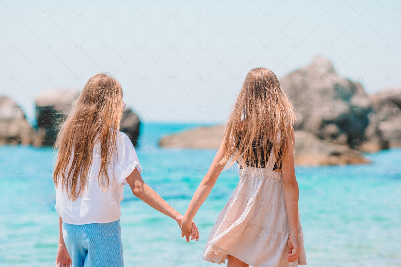 Sisters Beside The Ocean: Stock Photos