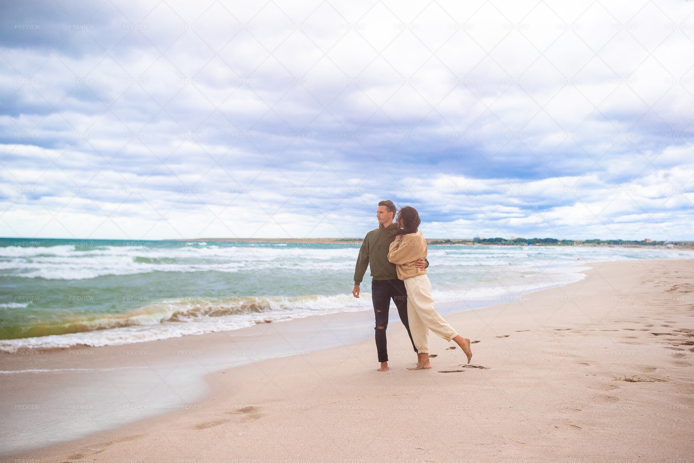 Couple On The Sand: Stock Photos