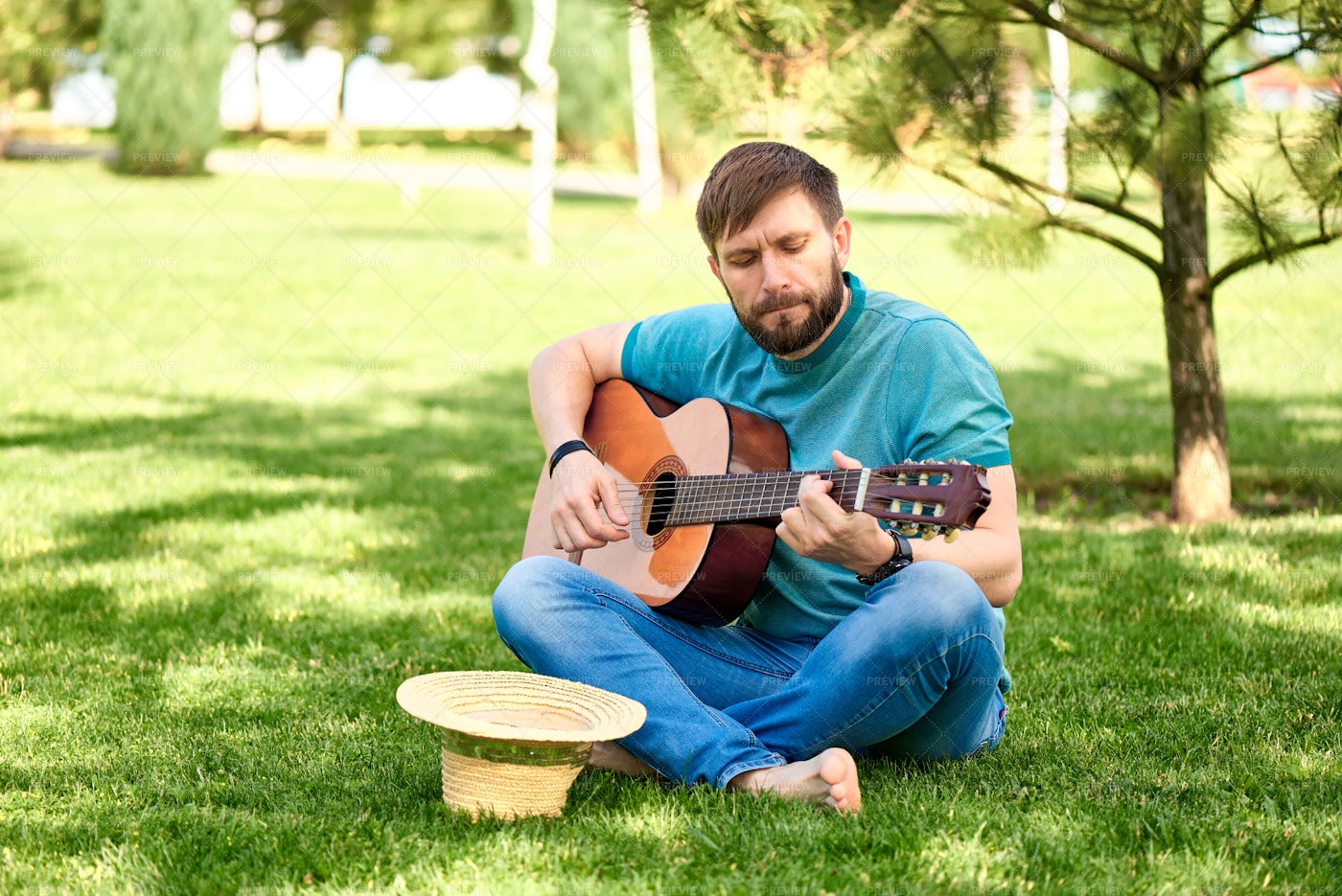 Practicing Guitar In A Park: Stock Photos