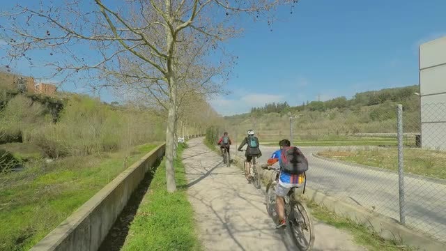Bikers Cycling Down Sidewalk: Stock Video