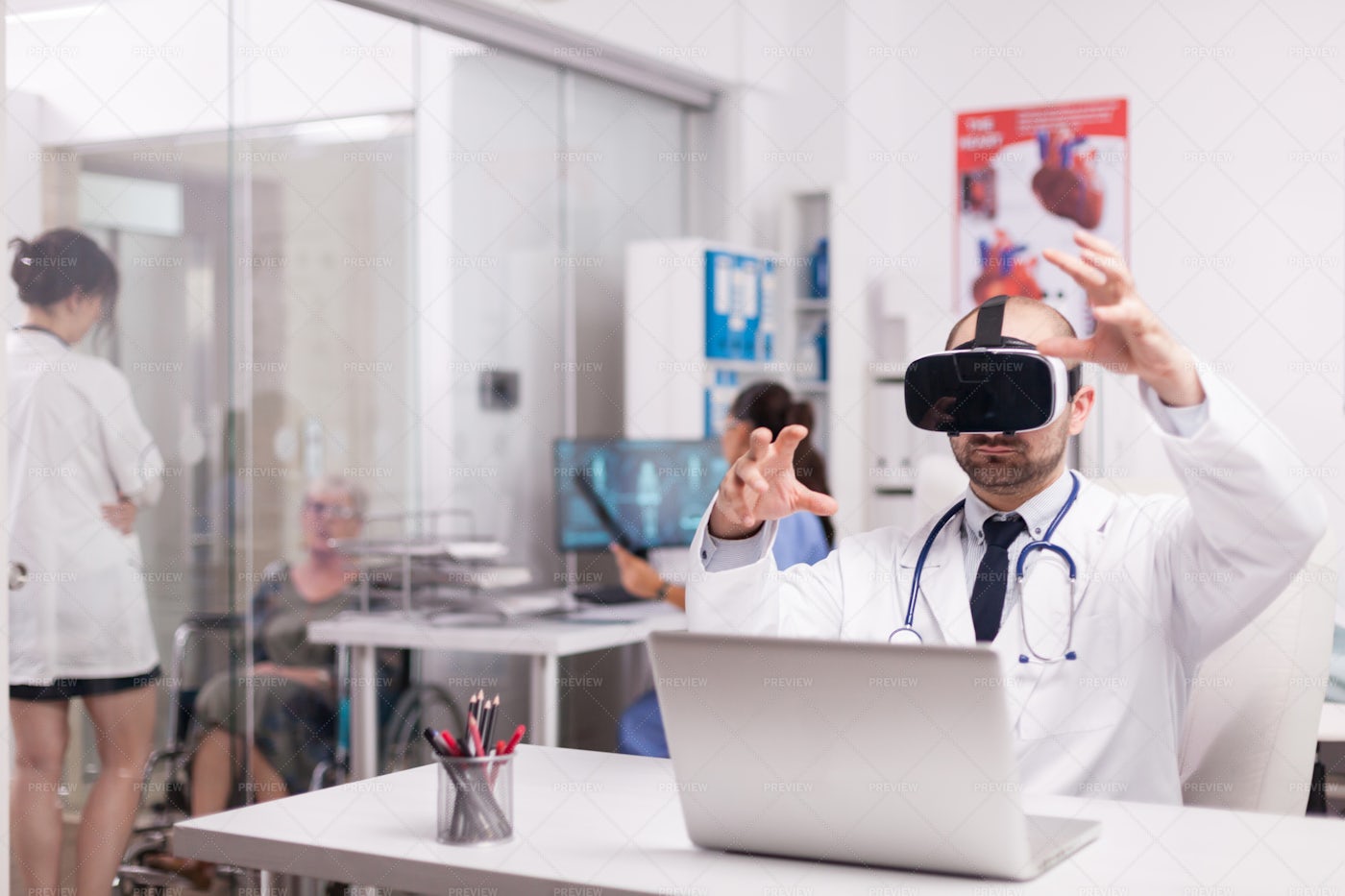 Physician With VR Goggles: Stock Photos