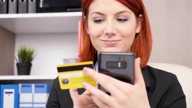 Woman Typing Credit Card Details: Stock Video