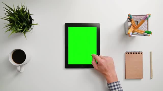 Man Scrolling On A Tablet: Stock Video