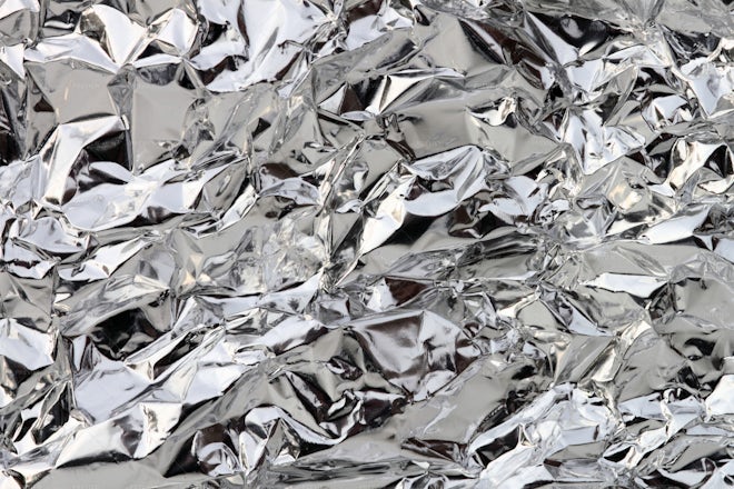 Gold crumpled aluminum foil texture