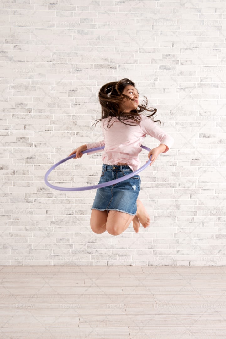Girl Jumping With Hula Hoop: Stock Photos