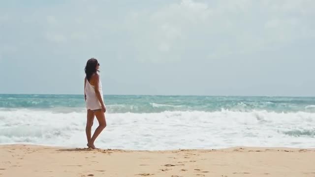 Woman Watching Ocean Waves: Stock Video