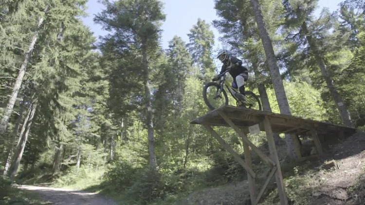 Mountain Cyclist Jumping Wooden Ramp: Stock Video
