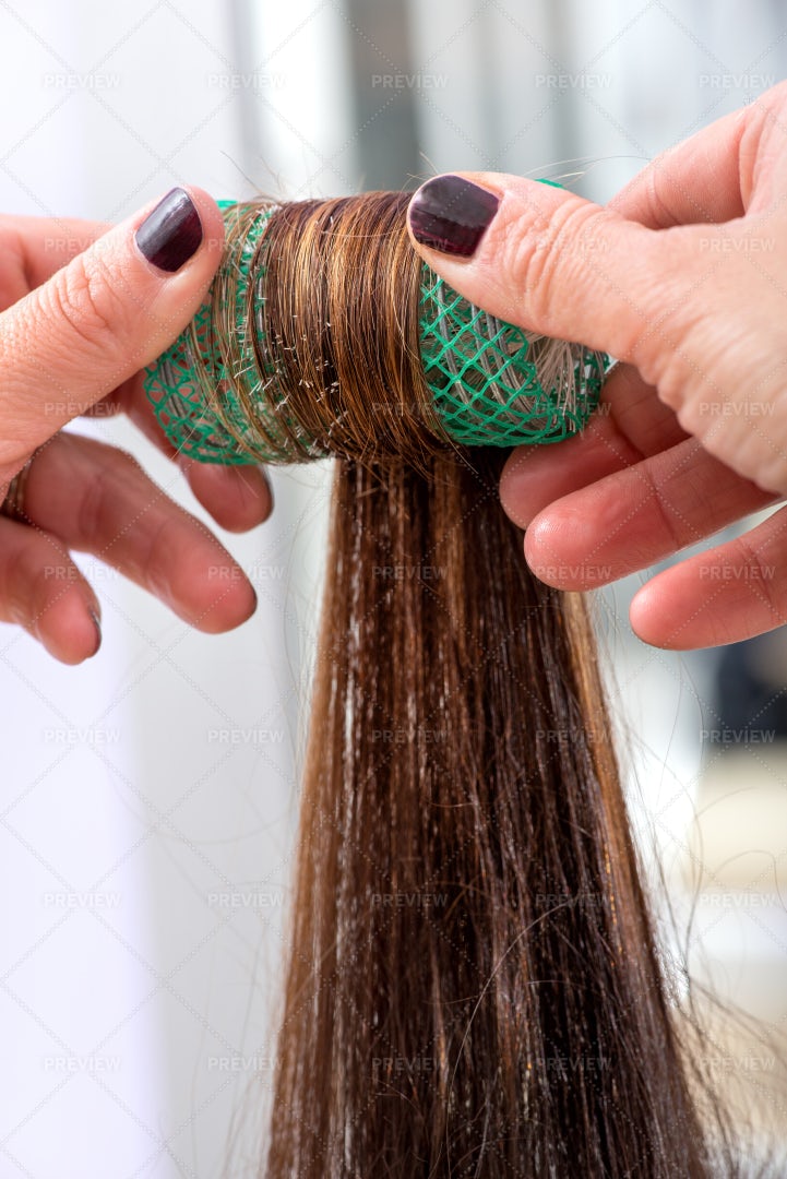 Rolling A Clients Hair: Stock Photos
