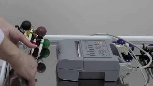 Cardiologist Collecting Sensors From ECG : Stock Video