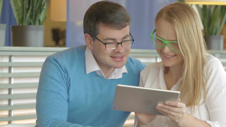 Couple Discussing Something On Tablet : Stock Video