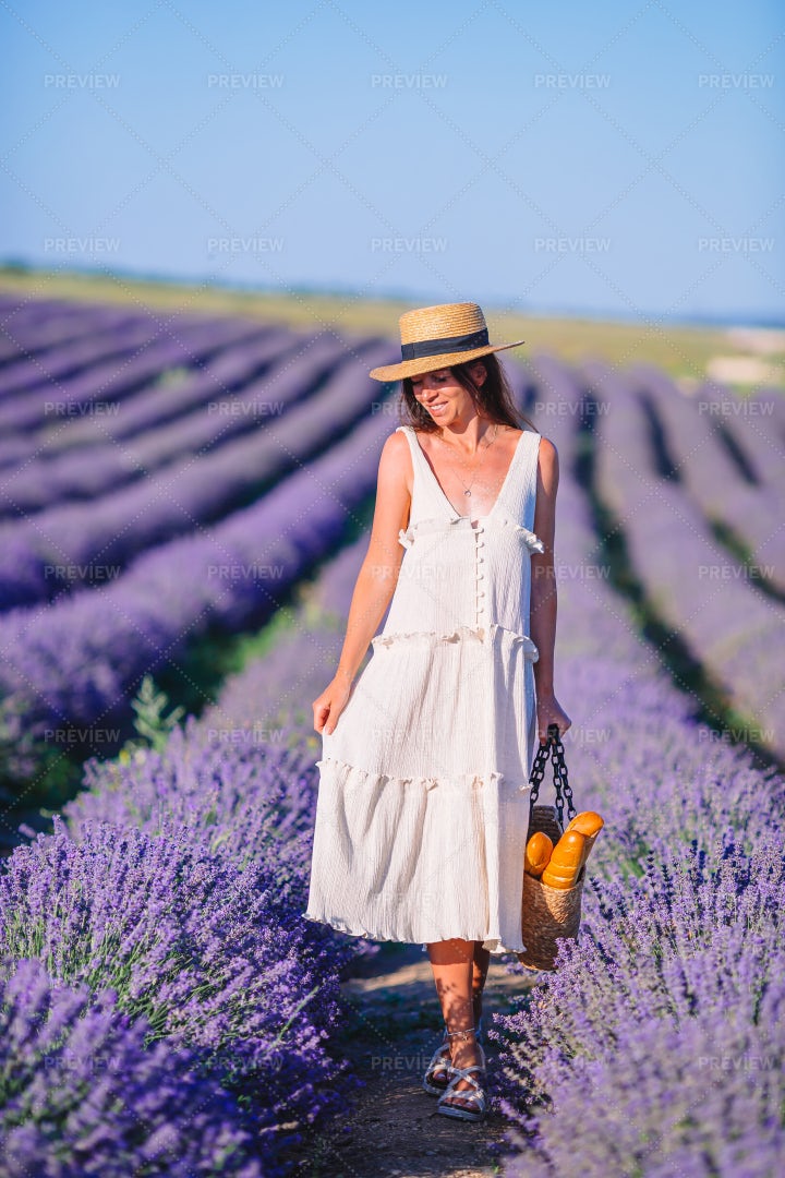 Woman Walking Through Lavender: Stock Photos