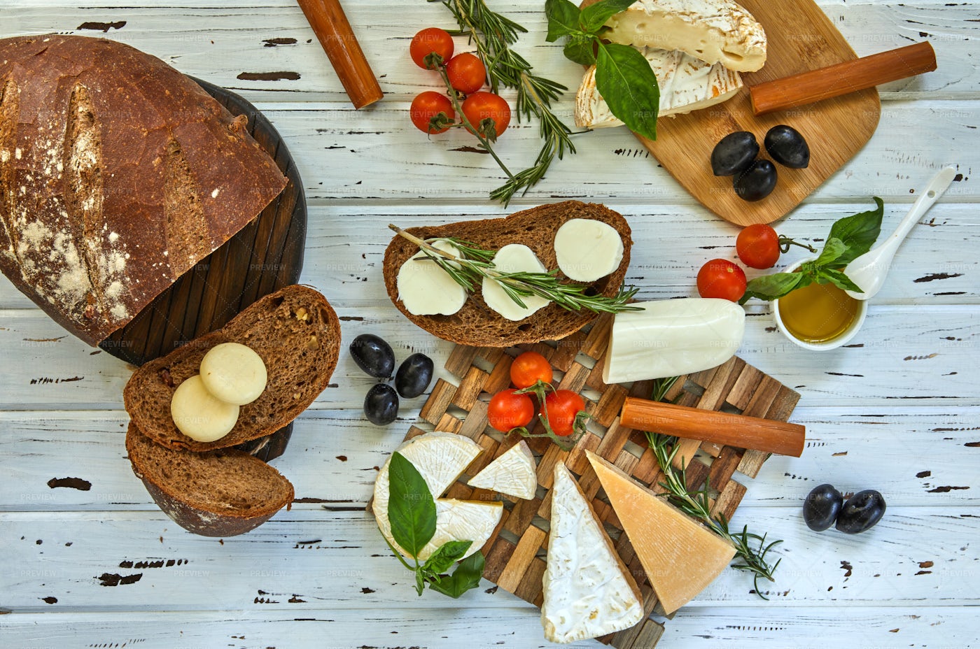 Various Cheeses, Bread And Veg: Stock Photos