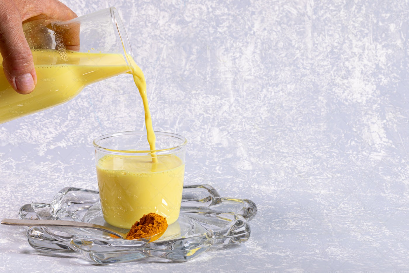 Pouring Turmeric Milk: Stock Photos