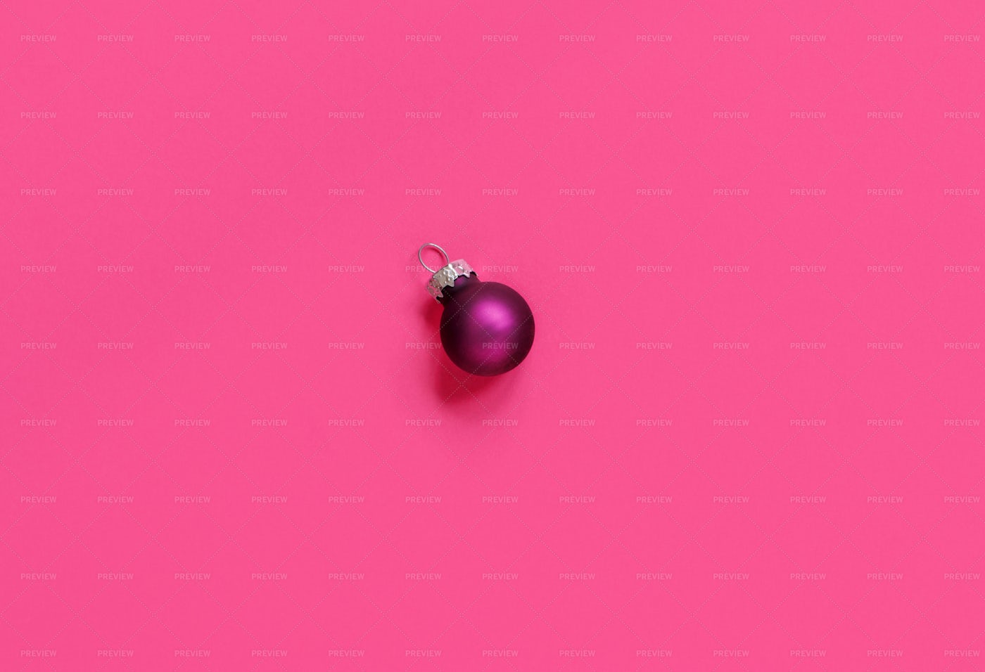 Single Purple Christmas Ornament On Pink: Stock Photos