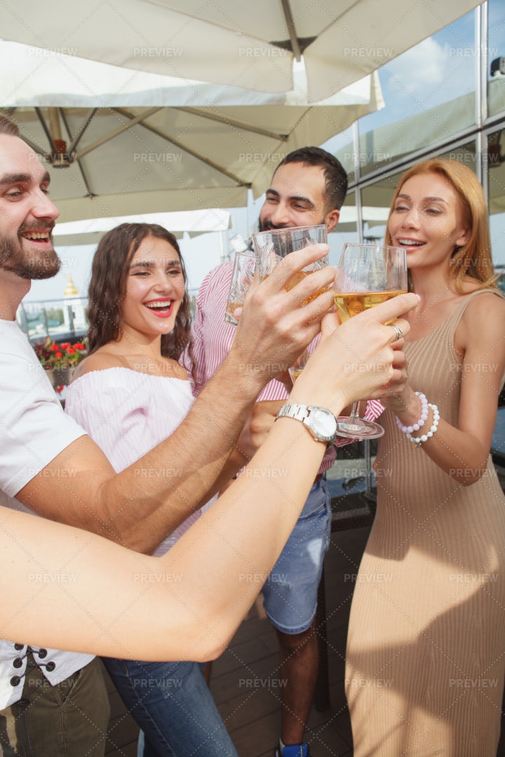 Friends Clinking Wine Glasses: Stock Photos