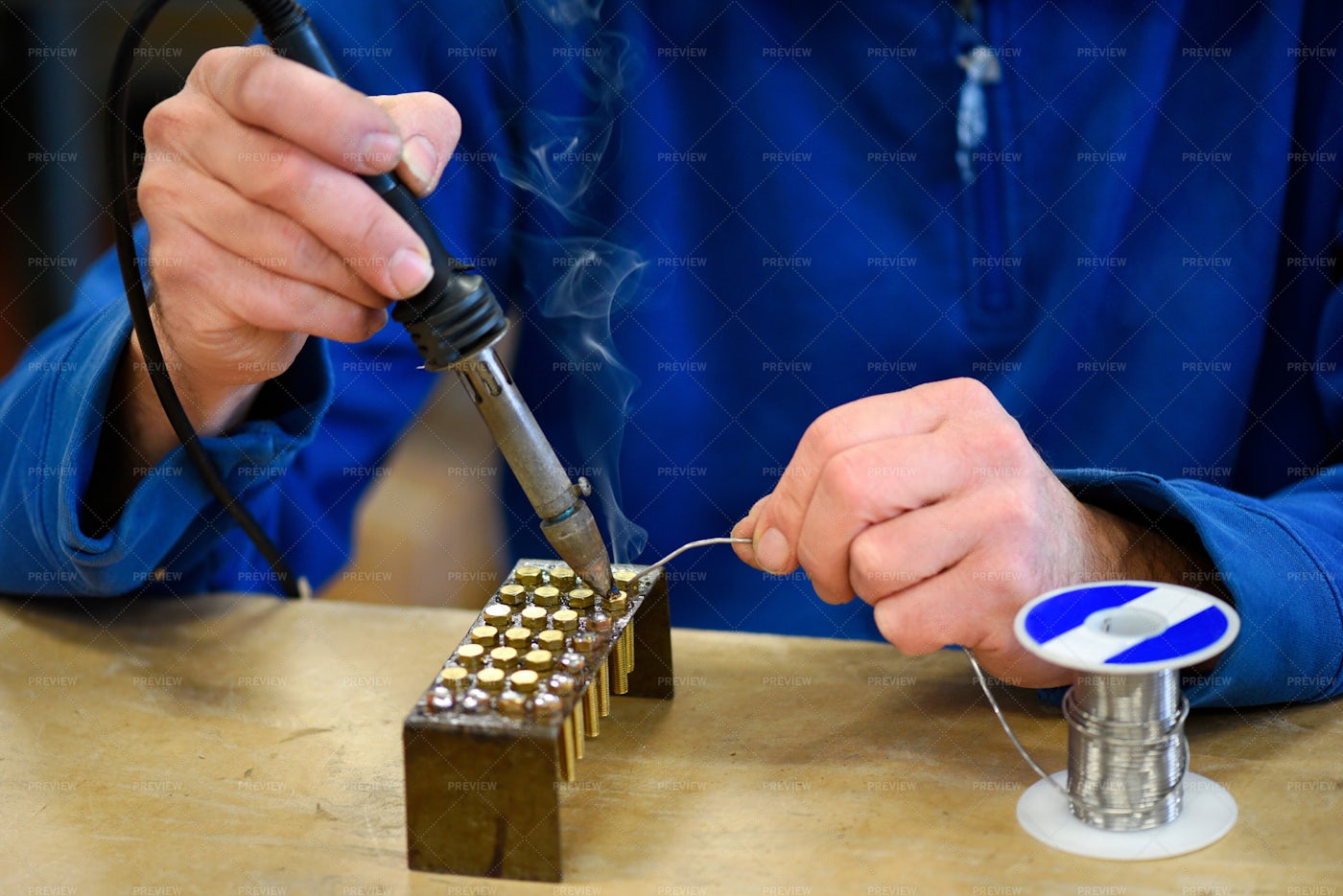 Worker Soldering Metal Parts: Stock Photos
