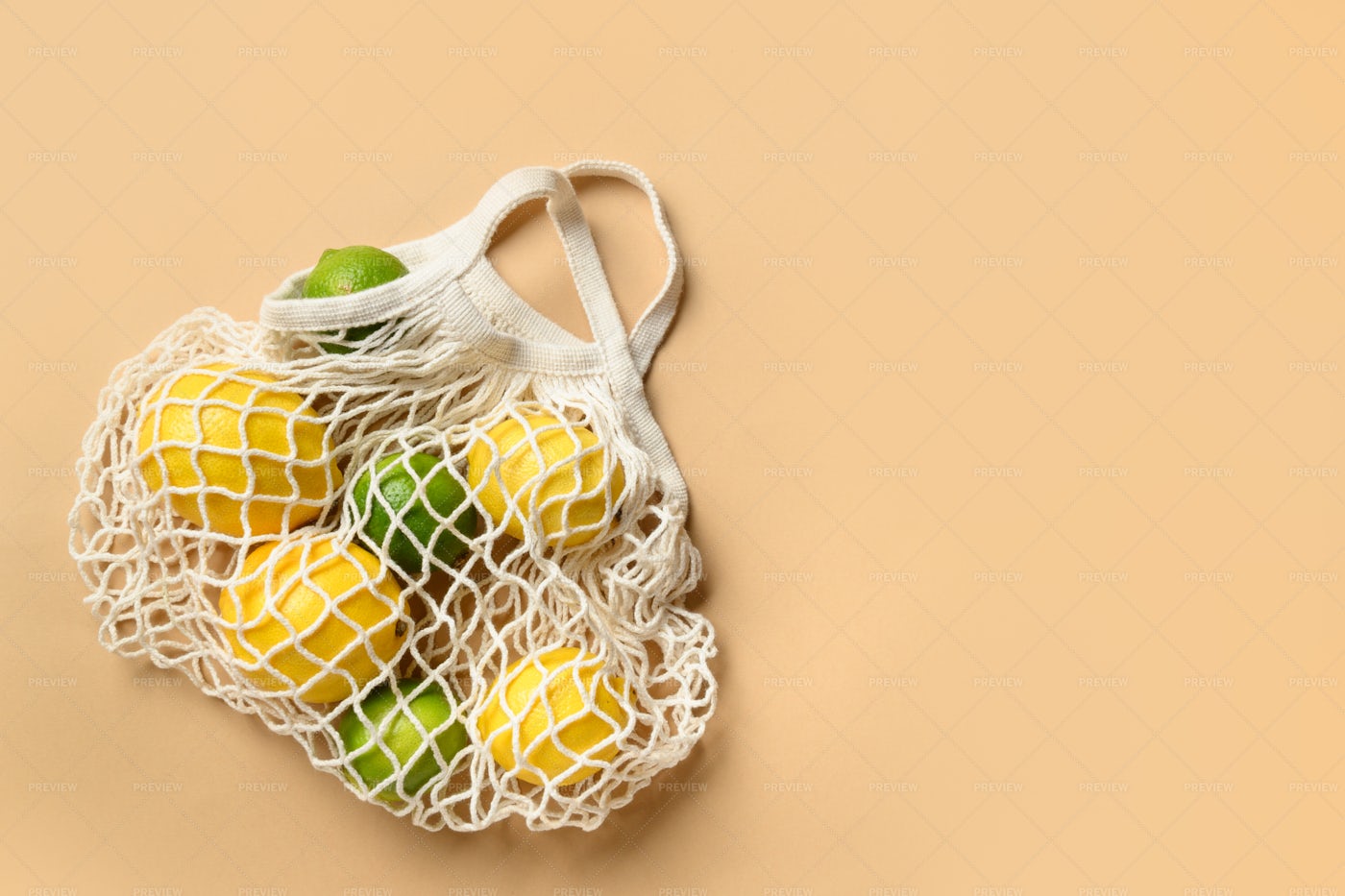 Eco Mesh Shopping Bag With Citrus Fruits: Stock Photos