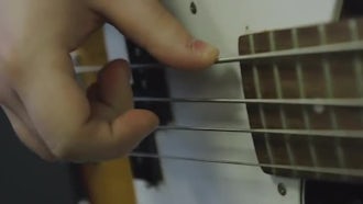Plucking The Bass Guitar: Stock Video