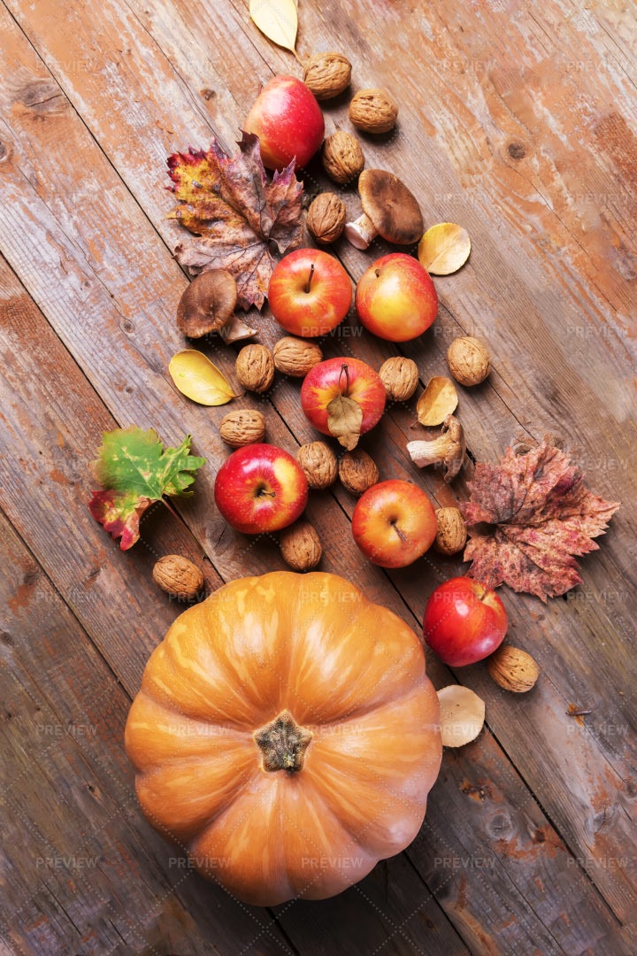 Orange Pumpkin With Fall Harvest Food: Stock Photos