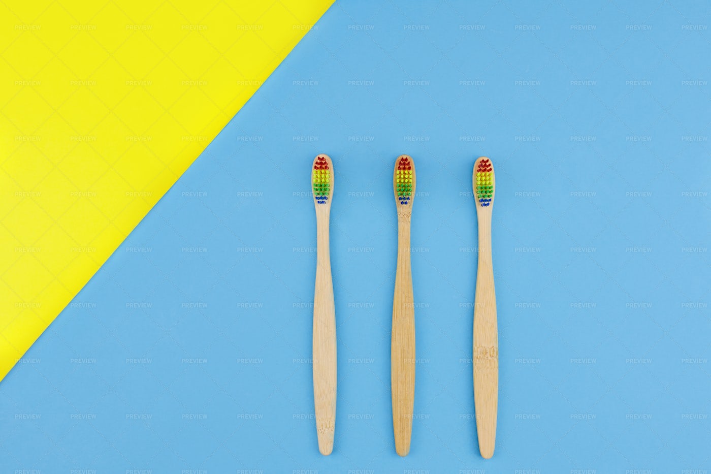 Three Rainbow Bamboo Toothbrushes: Stock Photos