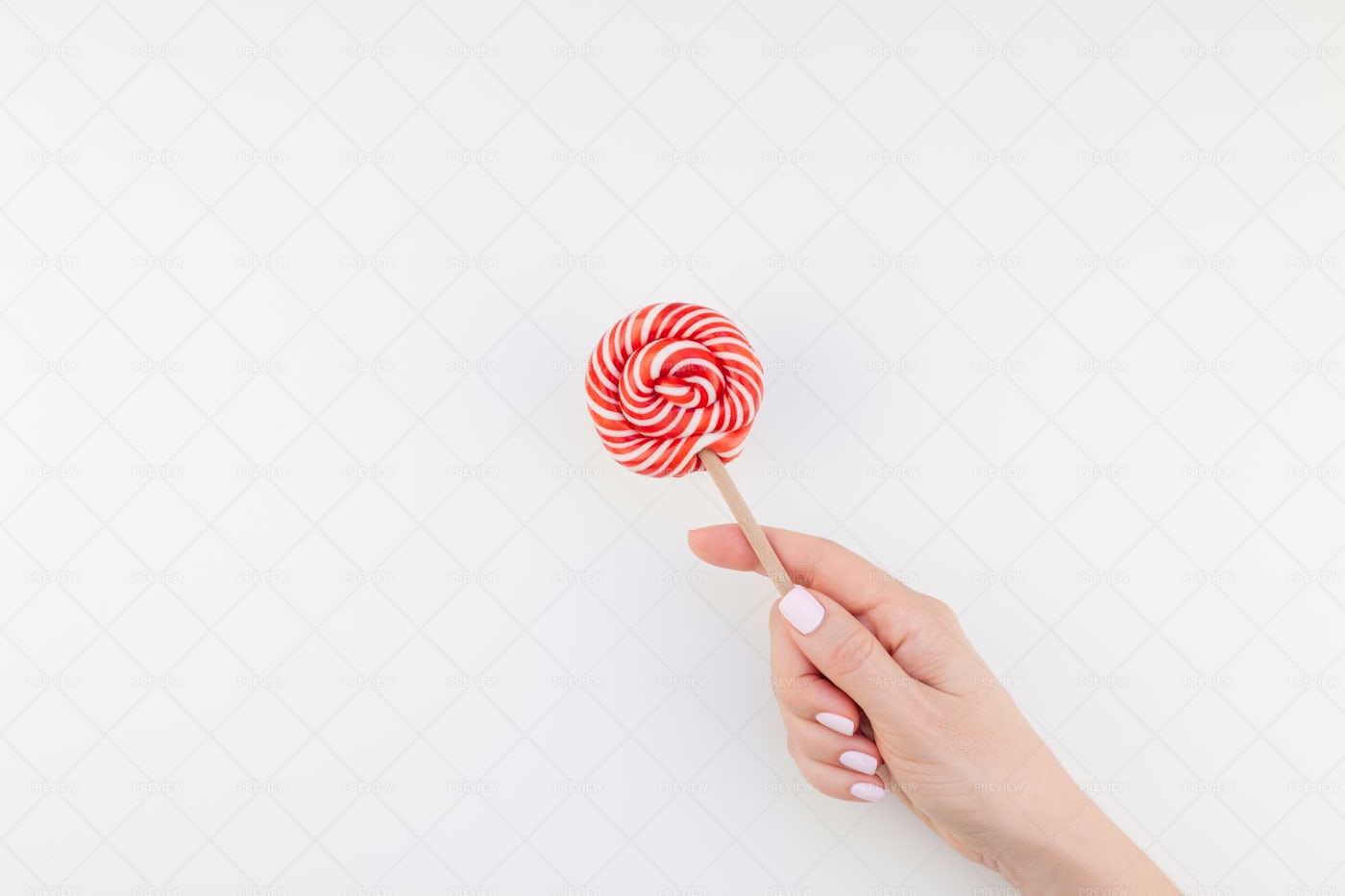 Hand With Red Lollipop: Stock Photos
