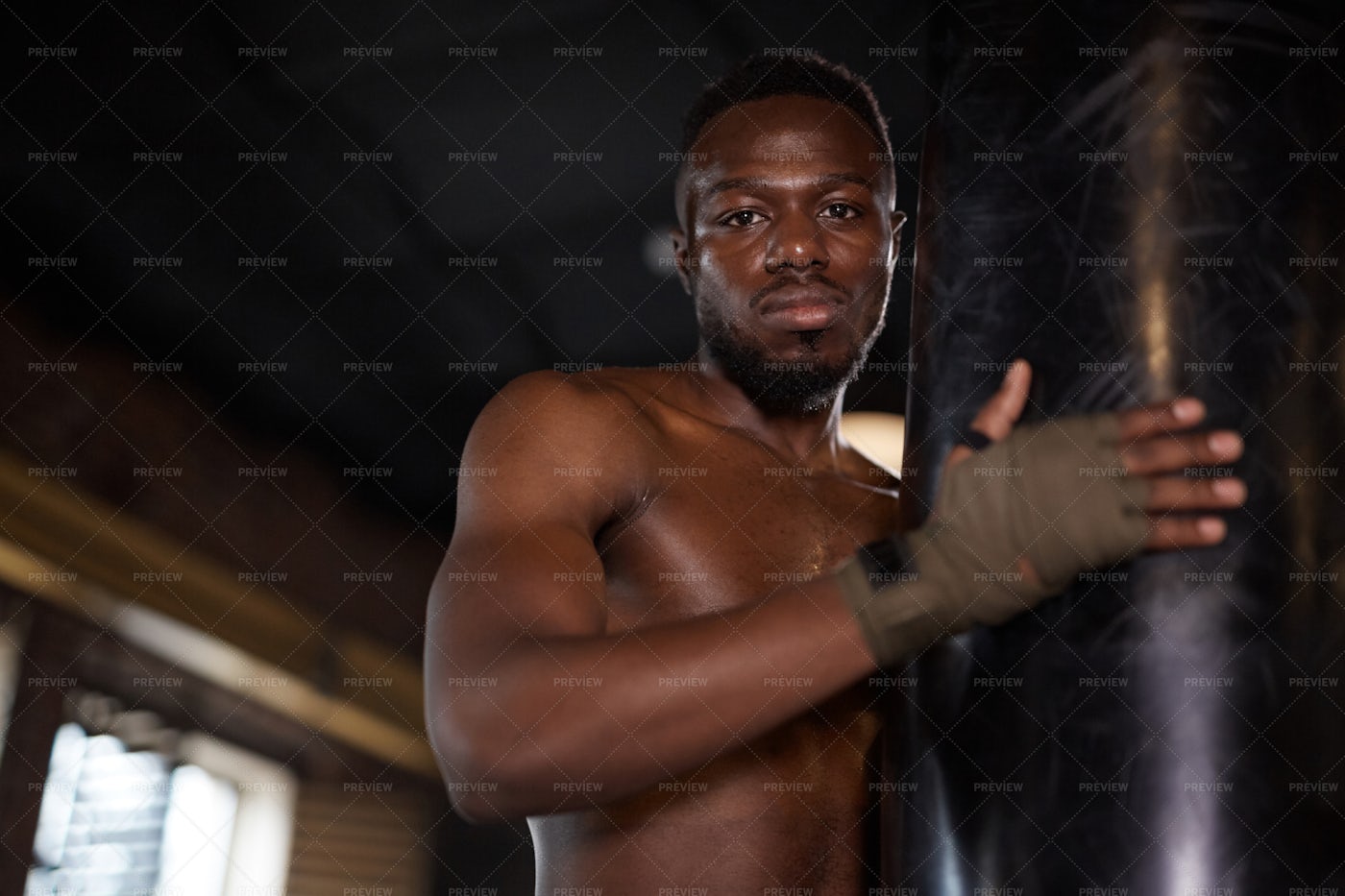 Boxer With Hand Wraps And Punching Bag: Stock Photos
