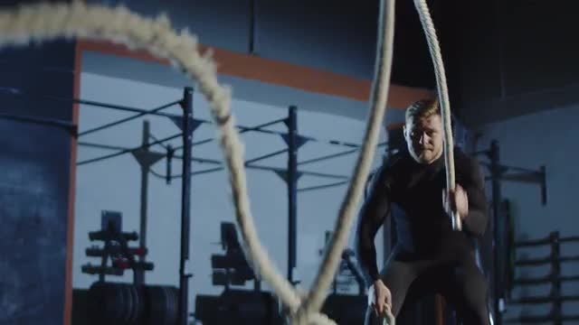 Athlete Playing With Battle Ropes: Stock Video